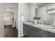 Double vanity bathroom with granite countertop and modern fixtures at 30 Hilltop Crest St, Henderson, NV 89011