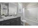 Clean bathroom with bathtub and granite vanity at 30 Hilltop Crest St, Henderson, NV 89011