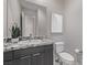 Elegant powder room with granite vanity and modern fixtures at 30 Hilltop Crest St, Henderson, NV 89011