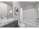 Clean bathroom with granite countertop, shower, and bathtub at 30 Hilltop Crest St, Henderson, NV 89011