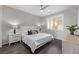 Spacious bedroom with dark hardwood floors and large window with plantation shutters at 30 Hilltop Crest St, Henderson, NV 89011
