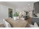 Open floor plan featuring a dining room with backyard access, and a kitchen with a large island at 30 Hilltop Crest St, Henderson, NV 89011