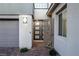 Close up of the front door and security gate at the front entrance at 30 Hilltop Crest St, Henderson, NV 89011