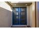 A close-up of the modern, blue front door at 30 Hilltop Crest St, Henderson, NV 89011