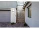 A detailed shot of the front entrance featuring a security gate at 30 Hilltop Crest St, Henderson, NV 89011