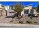 Beautiful single-story home with a two-car garage and desert landscaping at 30 Hilltop Crest St, Henderson, NV 89011