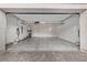 Spacious garage with overhead storage and electric car charger at 30 Hilltop Crest St, Henderson, NV 89011