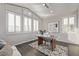 Bright home office features wood floors, plantation shutters, and a large desk at 30 Hilltop Crest St, Henderson, NV 89011