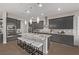 Spacious kitchen boasts a large island, stainless steel appliances, granite countertops, and ample lighting at 30 Hilltop Crest St, Henderson, NV 89011
