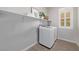 Convenient laundry room with washer, dryer, and shelving at 30 Hilltop Crest St, Henderson, NV 89011