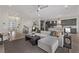 L-shaped living room with open kitchen and bar area at 30 Hilltop Crest St, Henderson, NV 89011