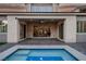 Relaxing covered patio with a view of the pool at 30 Hilltop Crest St, Henderson, NV 89011