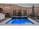 Inviting backyard pool with water feature and decorative screens at 30 Hilltop Crest St, Henderson, NV 89011