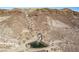 Series of small waterfalls cascading down a hillside at 30 Hilltop Crest St, Henderson, NV 89011