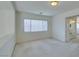 Spacious bedroom with window and bathroom access at 3107 Lenoir St, Las Vegas, NV 89135