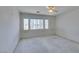 Well-lit bedroom with large window and ceiling fan at 3107 Lenoir St, Las Vegas, NV 89135