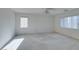 Spacious bedroom with large windows and ceiling fan at 3107 Lenoir St, Las Vegas, NV 89135
