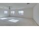 Large bedroom with three windows and ceiling fan at 3107 Lenoir St, Las Vegas, NV 89135
