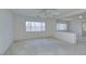 Bright bedroom with large windows and a ceiling fan at 3107 Lenoir St, Las Vegas, NV 89135