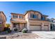 Two-story house with three-car garage and desert landscaping at 3107 Lenoir St, Las Vegas, NV 89135