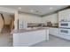 Spacious kitchen features an island, double oven, and views to staircase at 3107 Lenoir St, Las Vegas, NV 89135