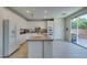 Galley kitchen with white cabinets and granite countertops at 3107 Lenoir St, Las Vegas, NV 89135