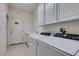 Laundry room with washer, dryer, and cabinets at 3107 Lenoir St, Las Vegas, NV 89135