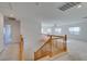 Upstairs hallway with wooden railing and carpet at 3107 Lenoir St, Las Vegas, NV 89135