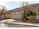 House exterior with beige paint, tile roof, and landscaping at 349 Yacht Ave, Henderson, NV 89012