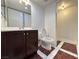 Clean bathroom with dark vanity and marble flooring at 3597 Arville St # 203B, Las Vegas, NV 89103