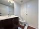 Clean bathroom with dark vanity and marble flooring at 3597 Arville St # 203B, Las Vegas, NV 89103