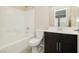 Clean bathroom with dark vanity, shower/tub combo at 368 Gracious Way, Henderson, NV 89011