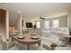 Virtually staged dining area with adjacent living space at 368 Gracious Way, Henderson, NV 89011