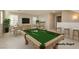 Virtually staged game room with pool table and seating area at 368 Gracious Way, Henderson, NV 89011