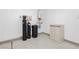 Garage with epoxy flooring, water softener, and storage cabinet at 368 Gracious Way, Henderson, NV 89011