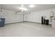 Bright garage with epoxy floor and automatic door opener at 368 Gracious Way, Henderson, NV 89011