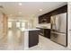 Open kitchen with stainless steel appliances and island at 368 Gracious Way, Henderson, NV 89011