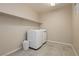 Laundry room with washer, dryer, shelving and tile floor at 368 Gracious Way, Henderson, NV 89011