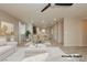 Virtually staged living room with dining area and neutral colors at 368 Gracious Way, Henderson, NV 89011