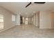 Open living room with tile floors and views into kitchen at 368 Gracious Way, Henderson, NV 89011