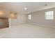 Spacious loft area with carpet, two windows, and overhead lighting at 368 Gracious Way, Henderson, NV 89011