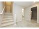 Bright entryway with staircase leading upstairs, and views to bathroom and bedroom at 368 Gracious Way, Henderson, NV 89011