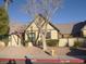 Cute stucco home with dark brown trim, American flag, and fire hydrant at 3940 Edgemoor Way, Las Vegas, NV 89121