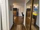 Long hallway with wood floors and mirrored closet doors at 3940 Edgemoor Way, Las Vegas, NV 89121