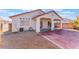 Home's backyard features a covered patio and AC unit at 402 Dune Ridge Ave, North Las Vegas, NV 89031