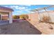 Backyard with covered patio, pergola, and gravel landscaping at 402 Dune Ridge Ave, North Las Vegas, NV 89031