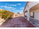 Spacious backyard with covered patio and brick pavers at 402 Dune Ridge Ave, North Las Vegas, NV 89031