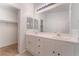 Bathroom with double vanity and walk-in closet at 402 Dune Ridge Ave, North Las Vegas, NV 89031