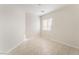 Simple bedroom with tile flooring and window at 402 Dune Ridge Ave, North Las Vegas, NV 89031