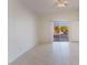 Bedroom with sliding glass doors leading to the backyard at 402 Dune Ridge Ave, North Las Vegas, NV 89031